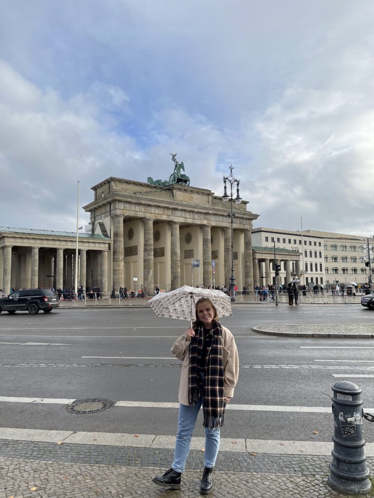 Posing outside the Brandenburg Gate- a must see for your long weekend in Berlin