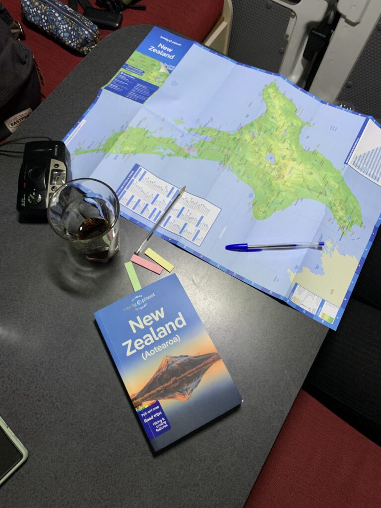 New Zealand guidebook and map as roadtrip planning essentials